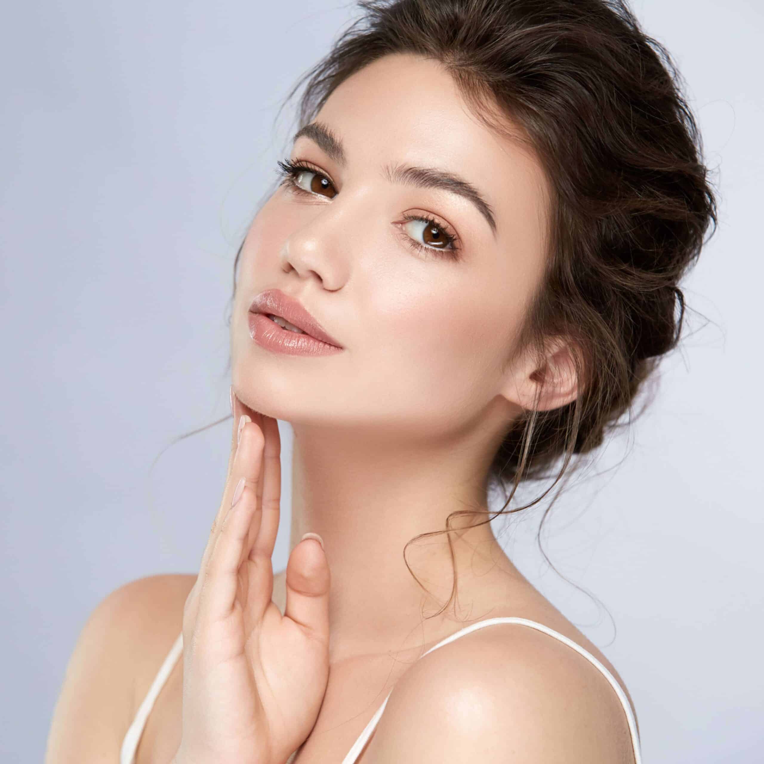 Woman with glowing, healthy skin representing KV Beauty Medspa results.